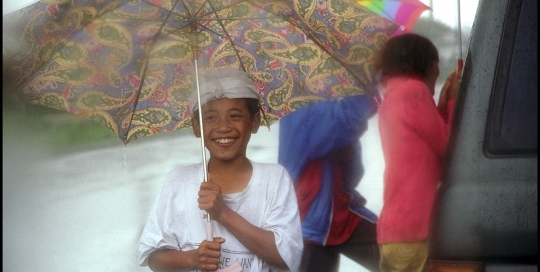 Boy Holding Umbrella